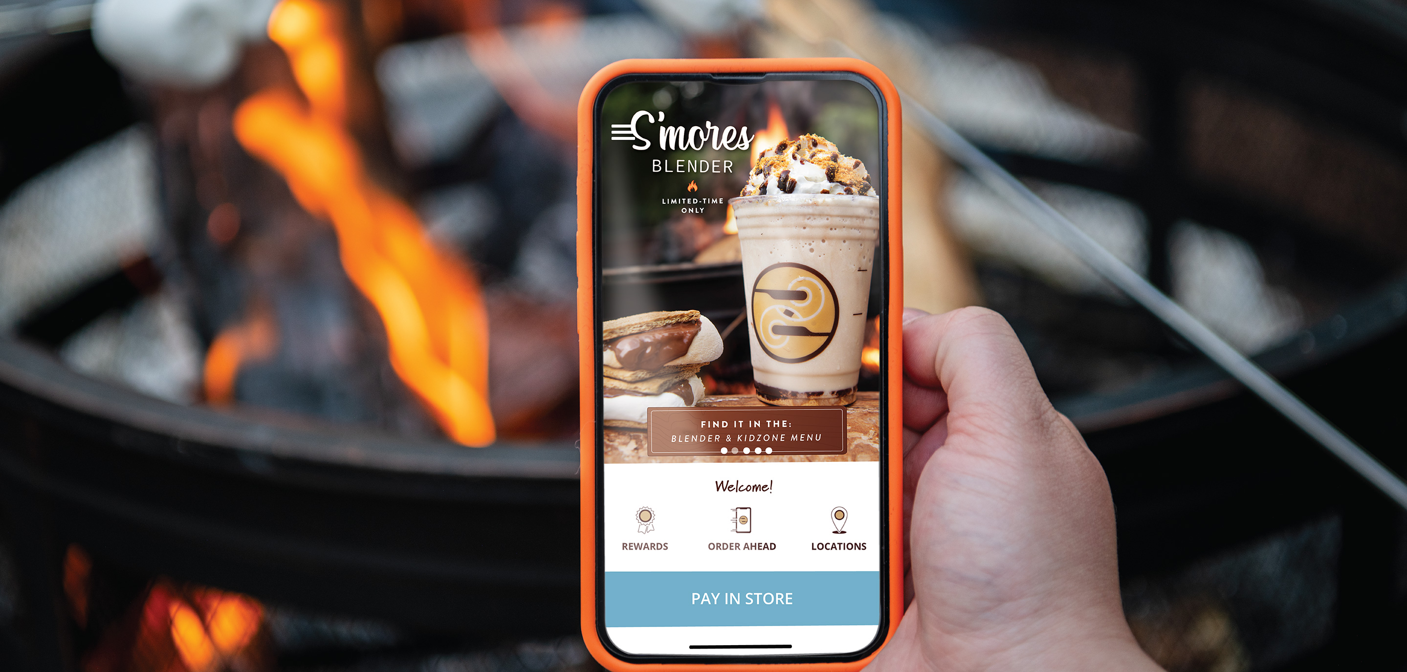 Zing's app shown on mobile phone in front of a campfire