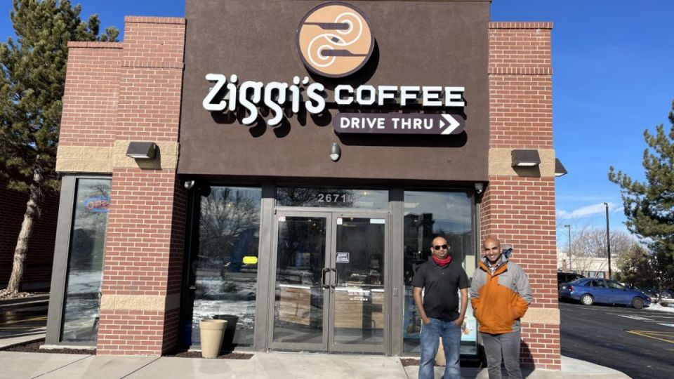 Franchisees Dian Mangalapallil and Sudhir Kumar Peri standing in-front of Ziggi's Coffee