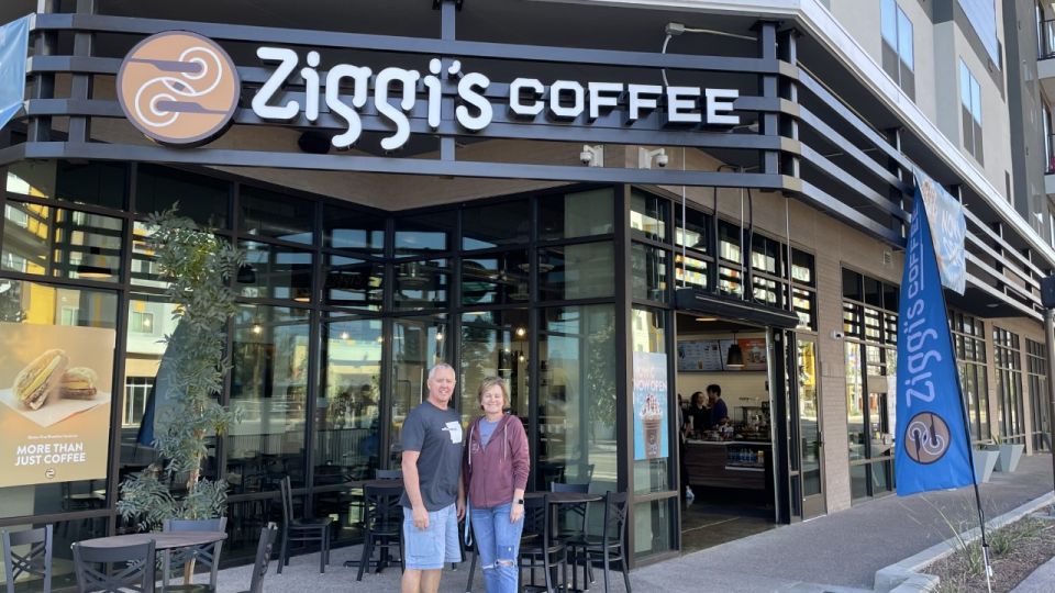 Franchisees Warren & Rhonda Stenseth standing in-front of Ziggi's Coffee