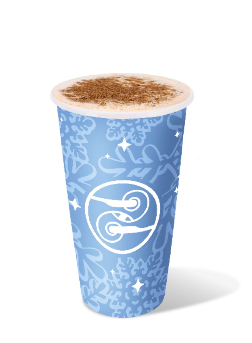 Hot Chai-Nog topped with cinnamon in a blue holiday cup with snowflake design.