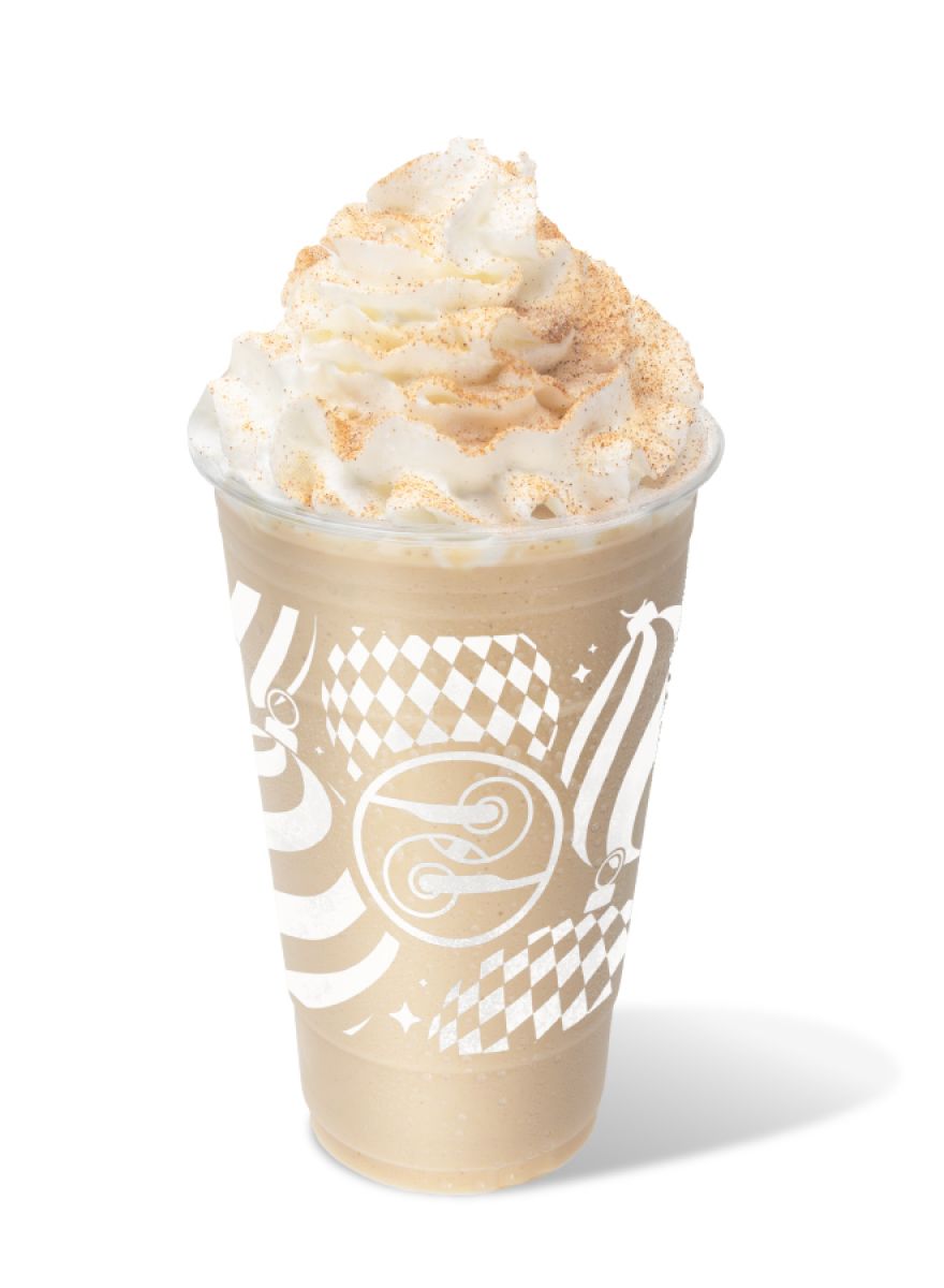 Blended Eggnog Latte topped with whipped cream and nutmeg in a holiday cup.