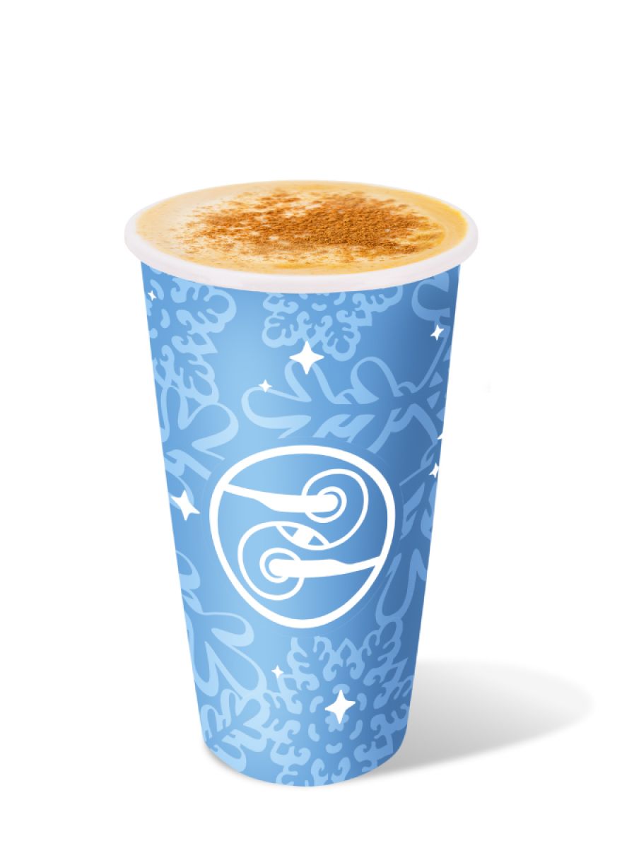 "Hot Eggnog Latte topped with cinnamon and nutmeg in a blue Ziggi’s holiday cup.