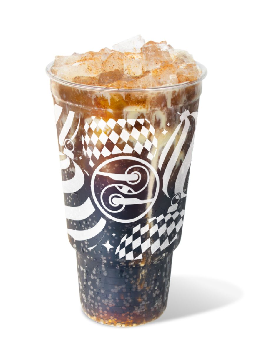 Sleighin’ Dirty drink with Dr Pepper, eggnog, cinnamon, and nutmeg served over ice in a festive Ziggi’s holiday cup.