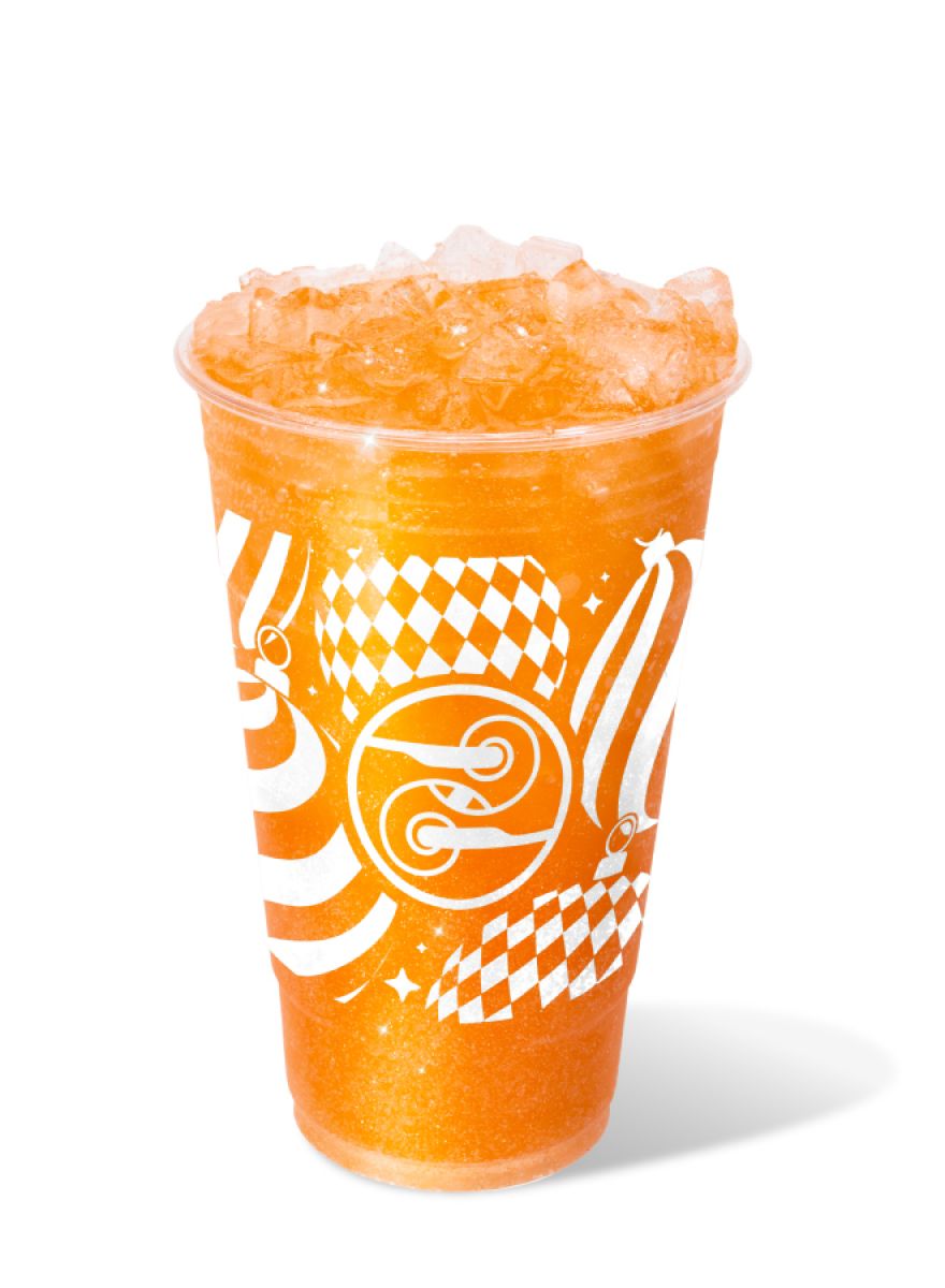 Sparkle & Spice Sparkling Soda with orange, pomegranate, cinnamon, and edible glitter.