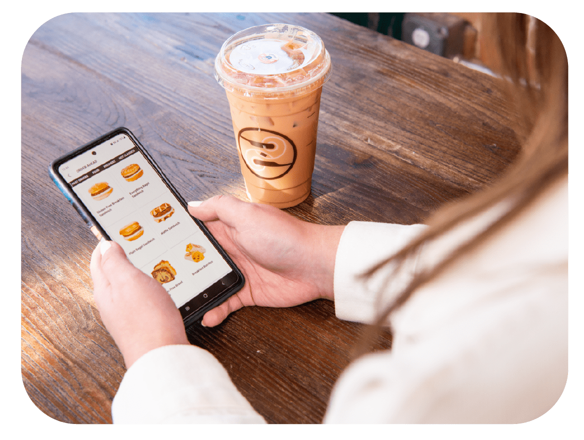 Person using Ziggi's Coffee App on phone